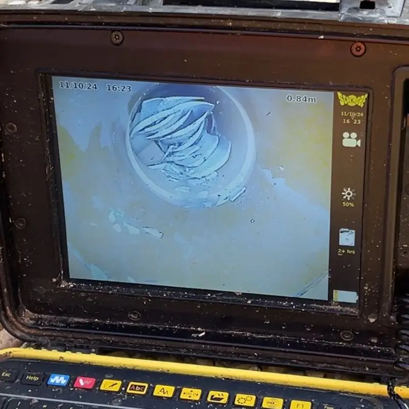 A CCTV Drain Survey Showing A Drain Blocked By Scale